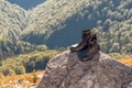 Black hiking boots on the rock