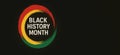 Black history month text in colorful circle design on black background Royalty Free Stock Photo