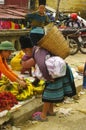 Black Hmong grandmother in market