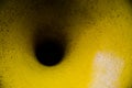 Black hole funnel on old yellow color surface. Royalty Free Stock Photo