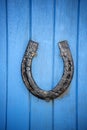 Black horseshoe on a blue door