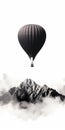 Black Hot Air Balloon Flying Over Clouds And Mountains Royalty Free Stock Photo