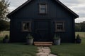 A black house with a porch and a wooden staircase in a field,ai generated Royalty Free Stock Photo