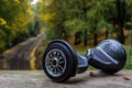Black hoverboard against the background of railroad rails Royalty Free Stock Photo