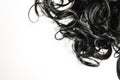Black human hair weaves. Wavy Ribbon Synthetic Ponytail Hair Extension. Beautiful wallpaper. Top view, isolated on white.