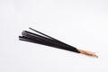 Some black Incense sticks isolated on white background