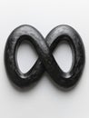 Black infinity symbol sculpture on white background. Royalty Free Stock Photo
