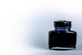 Black ink bottle on white background, writting ink for fountain pen Royalty Free Stock Photo