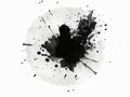 Black ink splatted onto white background, Black ink splat with splatter and copyspace Royalty Free Stock Photo