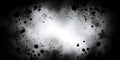 Black ink splattering on white and fading to black creating a textured frame Royalty Free Stock Photo