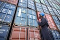 Black Inspector Inspecting the Containers at the Port