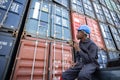 Black Inspector Inspecting the Containers at the Port