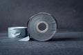 Black insulating tape rolls sitting on black background Royalty Free Stock Photo