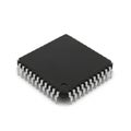 Black Integrated Circuit Chip with Silver Pins on a White Background microchip processor Royalty Free Stock Photo