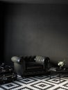 Black interior with leather armchair, coffee table and decor.