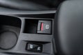 Black interior of a modern car, switch on the electrically assisted parking brake, handbrake. Royalty Free Stock Photo
