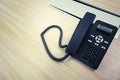 Black IP Phone, Office phone on the modern table in the meeting room