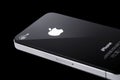 Black iPhone 4s on black background Royalty Free Stock Photo