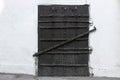Black iron door with bolts Royalty Free Stock Photo