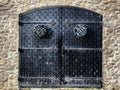 Black iron doors to castle, building in the historic center of the city, Pezinok, Slovakia Royalty Free Stock Photo