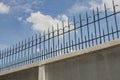 Black iron fence on white wall