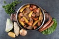 Black iron pan with cooked Brazilian food top view Royalty Free Stock Photo