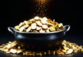 Black iron pot filled with gold coins. Generative AI Royalty Free Stock Photo