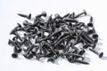 Black iron screws, dowel nails for wood, concrete. Fasteners, hardware Royalty Free Stock Photo