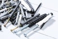 Black iron screws, dowel nails for wood, concrete. Fasteners, hardware. Royalty Free Stock Photo