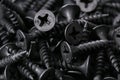 Black iron screws, dowel nails for wood, concrete. Fasteners, hardware Royalty Free Stock Photo