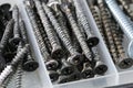 Black iron screws, dowel nails for wood, concrete. Fasteners, hardware Royalty Free Stock Photo