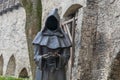 Black iron statue of a faceless monk in Tallinn.