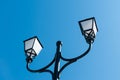 Black iron street lamp with white glass