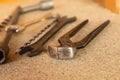 Black iron tools for the construction of nippers, wrench and long drill close-up Royalty Free Stock Photo