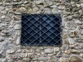 Black iron window to castle with bars, building in the historic center of the city, Pezinok Royalty Free Stock Photo