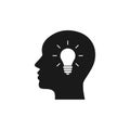 Black isolated icon of head of man and light bulb on white background. Silhouette of head of man and light bulb. Symbol of idea. Royalty Free Stock Photo