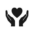 Black isolated icon of heart in hands on white background. Silhouette of heart and hands. Symbol of care, love, charity