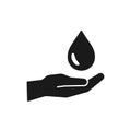 Black isolated icon of water drop, oil in hand on white background. Silhouette of aqua drop and hand. Symbol of care, charity.