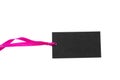 Black isolated recycle tag with pink satin ribbon top view on a white background Royalty Free Stock Photo