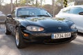 black Japanese two-seater sports car, Mazda MX-5 Miata NB