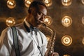Black jazz performer plays the saxophone on stage Royalty Free Stock Photo