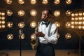 Black jazz performer plays the saxophone on stage