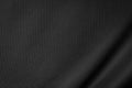 Black jersey texture background. Detail of luxury fabric surface