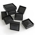 Black jewelry boxes opened isolated against white background Royalty Free Stock Photo