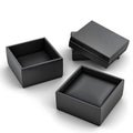 Black jewelry boxes opened isolated against white background Royalty Free Stock Photo
