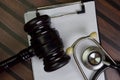 Black Judges gaves and Stethoscope or Medical Jurisprudence, Medical Law Concept