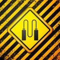 Black Jump rope icon isolated on yellow background. Skipping rope. Sport equipment. Warning sign. Vector Illustration