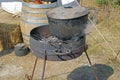 Black kettle for campfire on tripod Royalty Free Stock Photo
