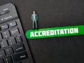 the word ACCREDITATION on black background.