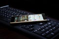 Black keyboard with mobile Royalty Free Stock Photo